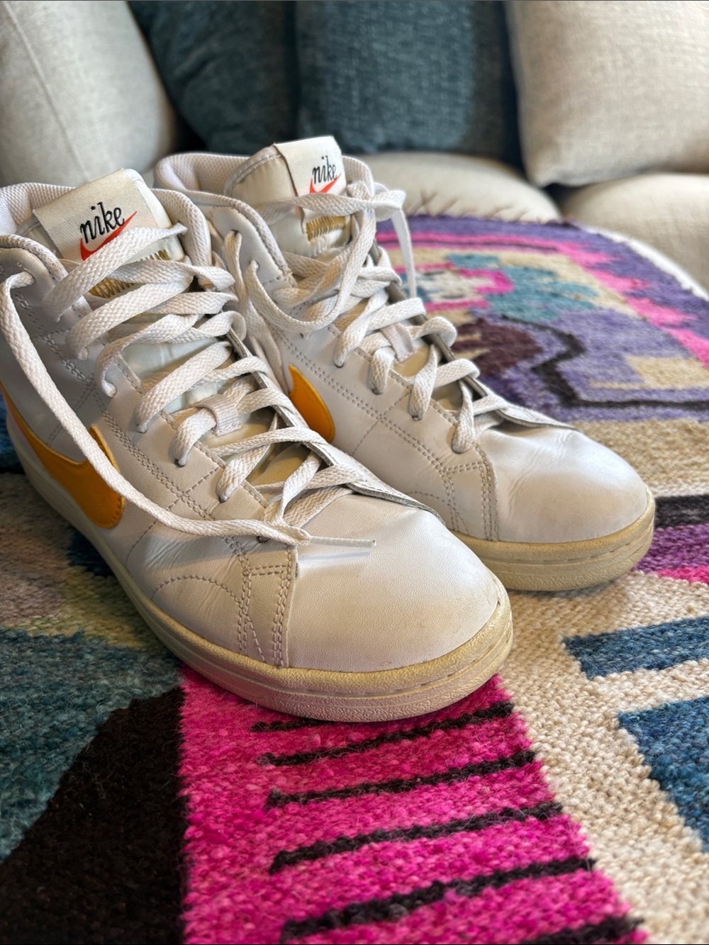 Nike White High-Top Sneakers with Yellow Swoosh